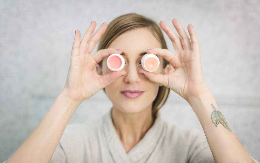 General tips for glowing skin around the eyes Woman holding two round items in front of her eyes