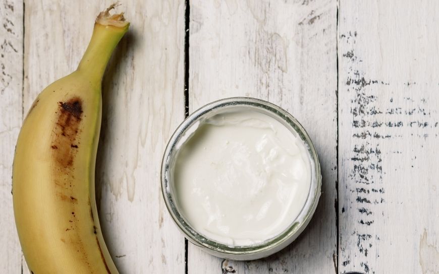 A bowl with Greek yogurt and a banana
