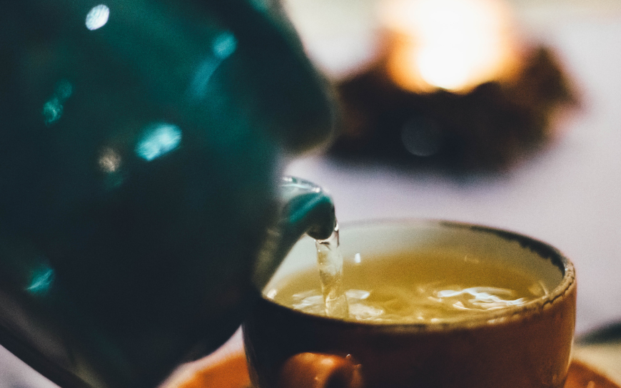 Put chamomile bags on your eyes Pouring chamomile from a pot