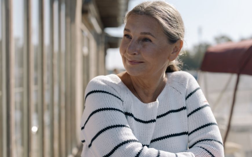 Skin Care Products you Should be Using in your 50’s Woman in her 50's gazing
