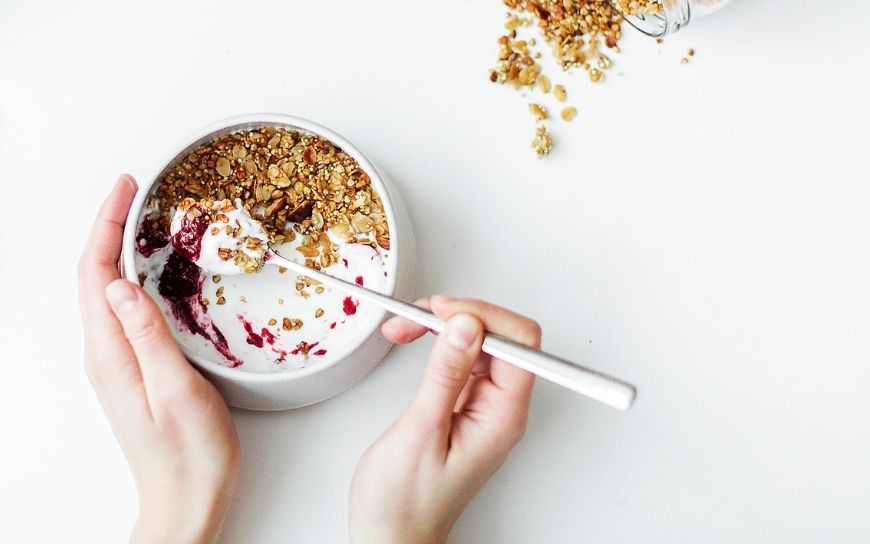 A bowl with Greek yogurt and oat flakes