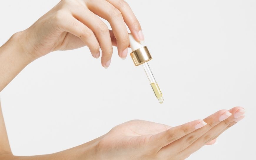 Pouring oil from one hand to another